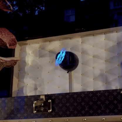 Louis Vuitton 3D futuristic hologram displayed above a box.